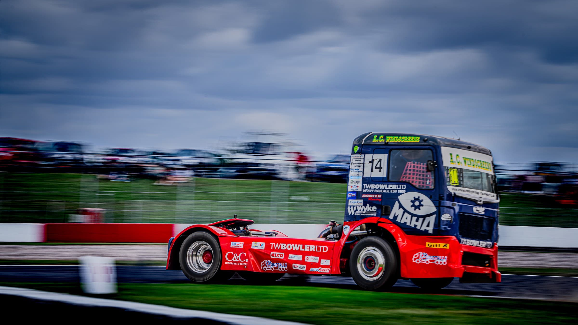 Bowler Racing truck number 14 racing on circuit