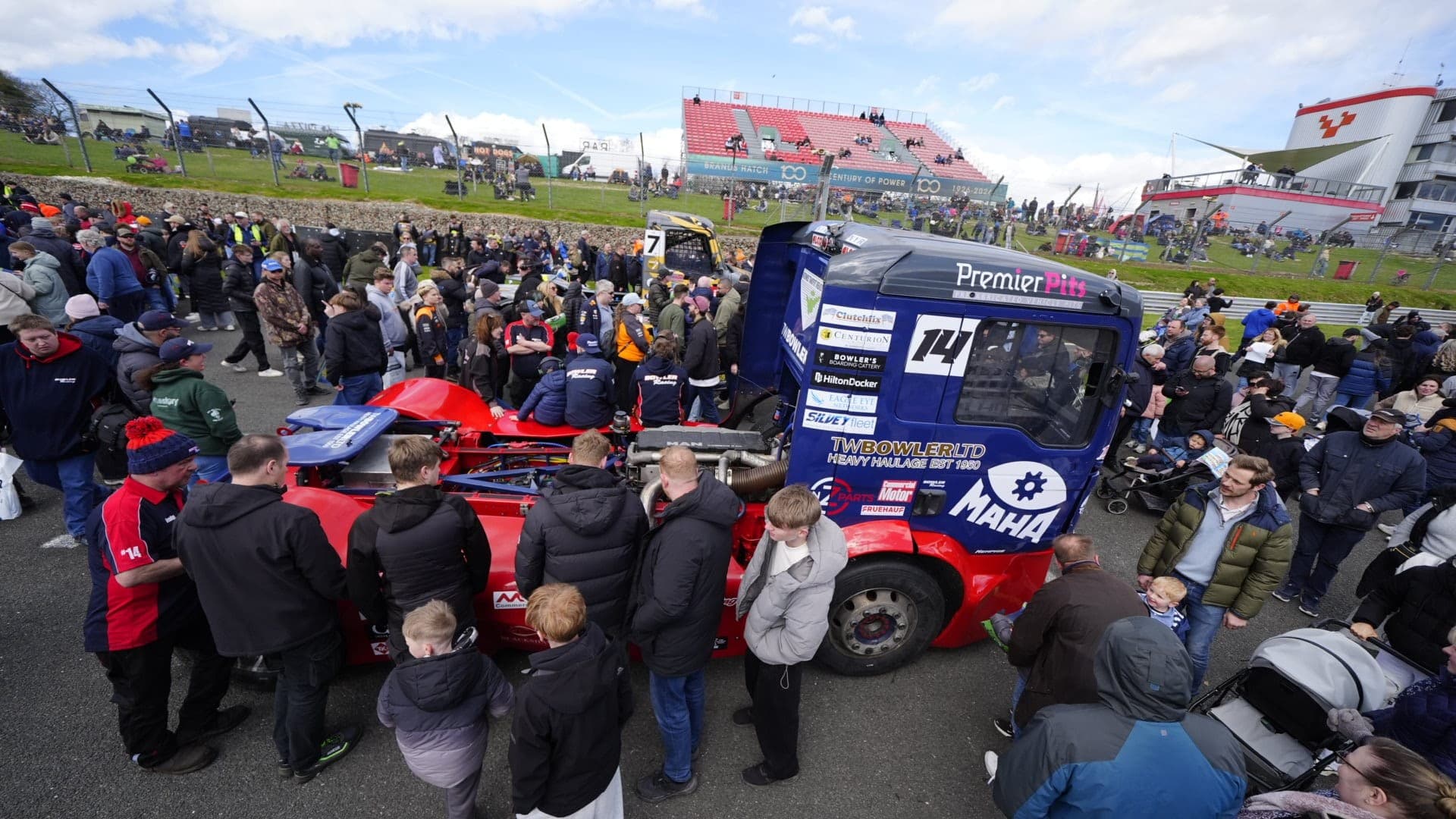 A large crowd of supporters gathered around Bowler Racing truck Diana number 14