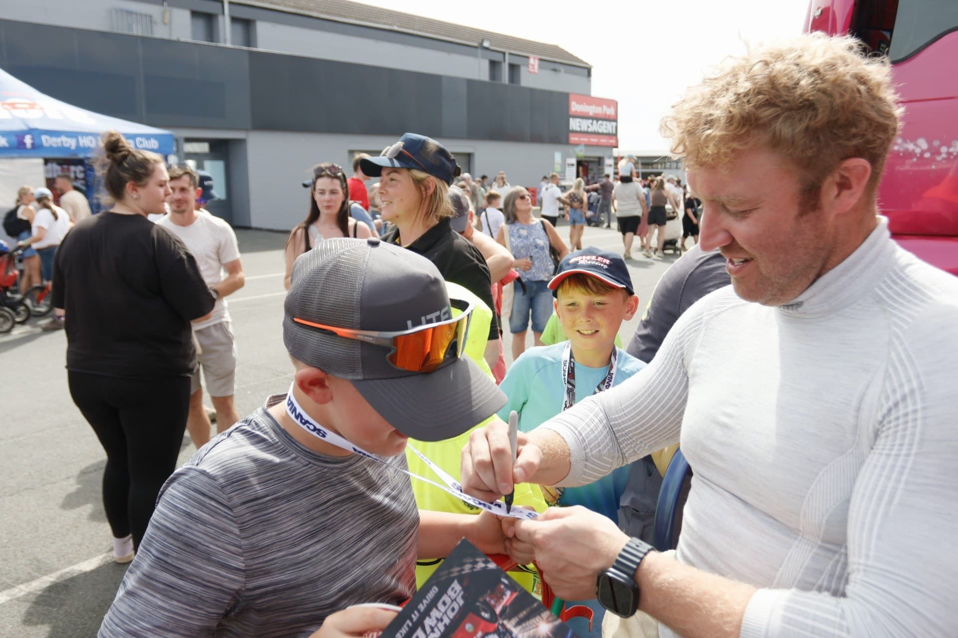 John Bowler signing autographs for young supporters at Donington Park